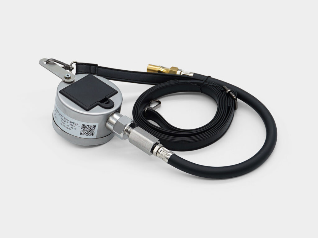 Handheld gauge with hose for flexible field testing